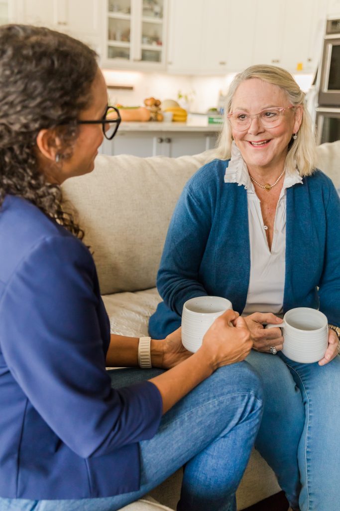 Doris is sitting talking with Deborah a wellness coaching client about the lifestyle changes she has for 2025.